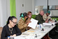 Group at a table working. 