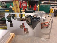 Metal sculpture with cutouts in different ambiguous shapes.
